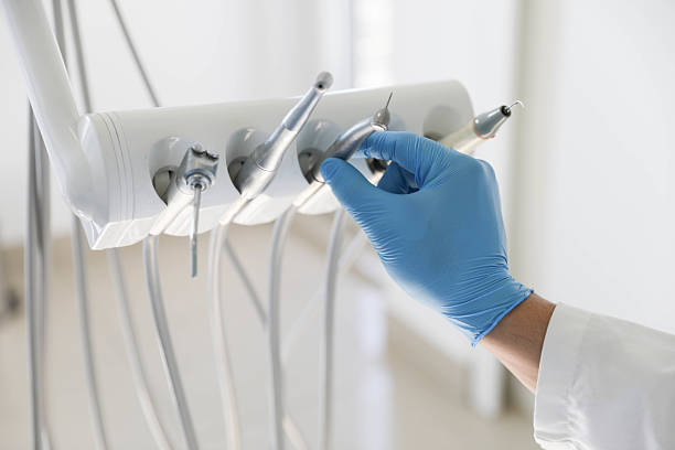 Professional Tooth Extraction technician working in Cadillac, MI
